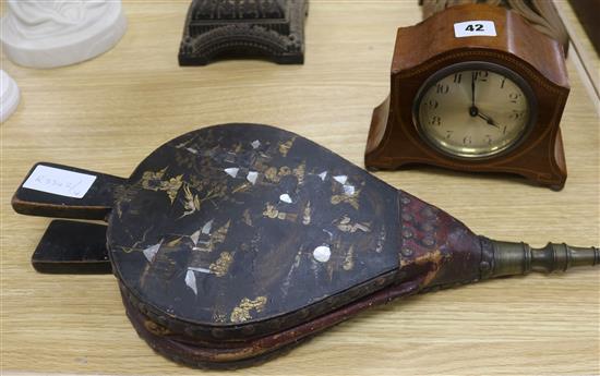 A pair of Chinoiserie bellows and an inlaid mantel clock